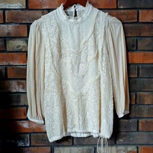 Anthropologie tiny cream colored top size xs great condition